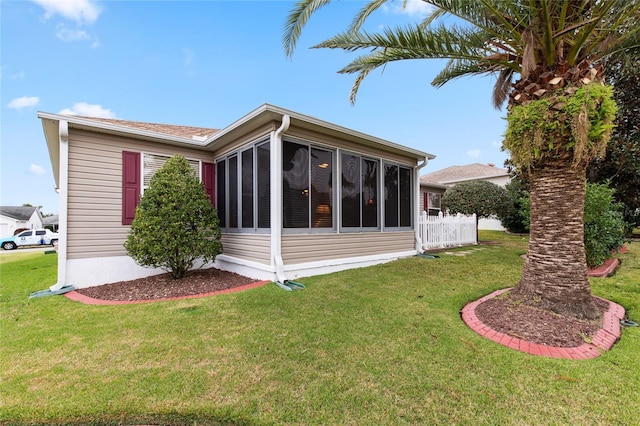 1526 Blueberry Way, The Villages, FL 32162 - back of property featuring a sunroom and a lawn