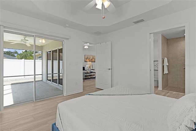 bedroom with access to outside, light wood-type flooring, ensuite bathroom, visible vents, and ceiling fan