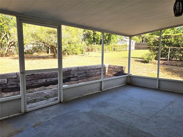 unfurnished sunroom with a wealth of natural light