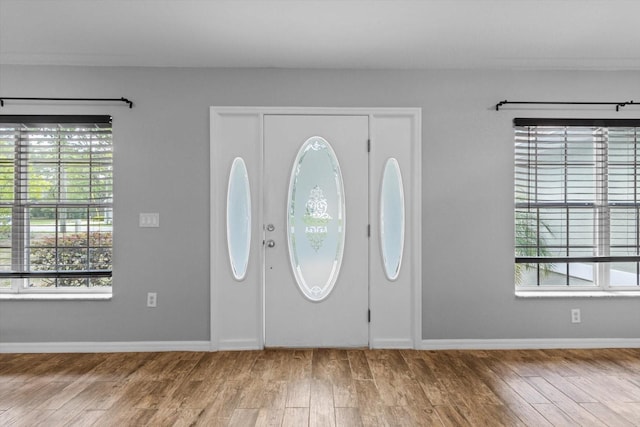 17 Eugenia Ct N, Homosassa, FL 34446 - foyer featuring baseboards and wood finished floors