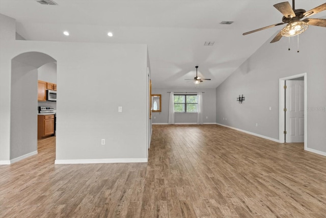 17 Eugenia Ct N, Homosassa, FL 34446 - unfurnished living room featuring baseboards, arched walkways, ceiling fan, light wood-type flooring, and recessed lighting