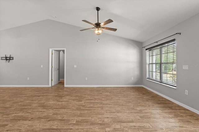 17 Eugenia Ct N, Homosassa, FL 34446 - spare room with light wood-style flooring, high vaulted ceiling, baseboards, and a ceiling fan