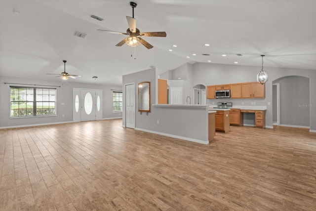 17 Eugenia Ct N, Homosassa, FL 34446 - unfurnished living room featuring baseboards, light wood-style flooring, visible vents, ceiling fan, and arched walkways