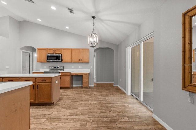 17 Eugenia Ct N, Homosassa, FL 34446 - kitchen with light countertops, light wood-style floors, visible vents, stainless steel appliances, and arched walkways