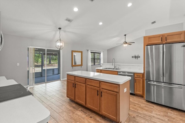 17 Eugenia Ct N, Homosassa, FL 34446 - kitchen featuring vaulted ceiling, light countertops, visible vents, appliances with stainless steel finishes, and a sink