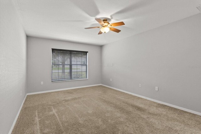 17 Eugenia Ct N, Homosassa, FL 34446 - unfurnished room with carpet flooring, baseboards, and ceiling fan