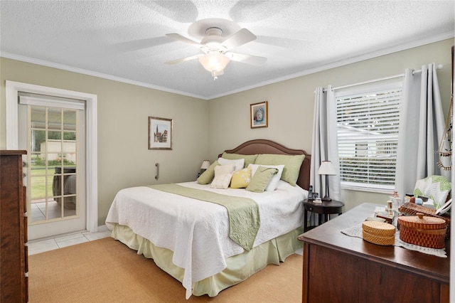 bedroom featuring access to exterior, multiple windows, and a textured ceiling