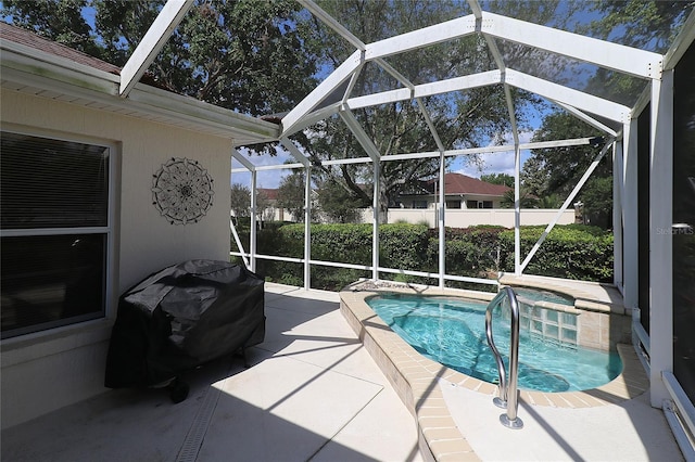 view of pool with a fenced in pool, a patio, a grill, and glass enclosure