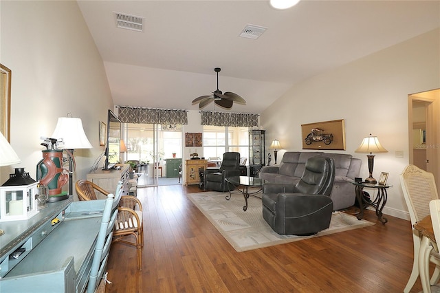 living room featuring visible vents, ceiling fan, wood finished floors, and vaulted ceiling