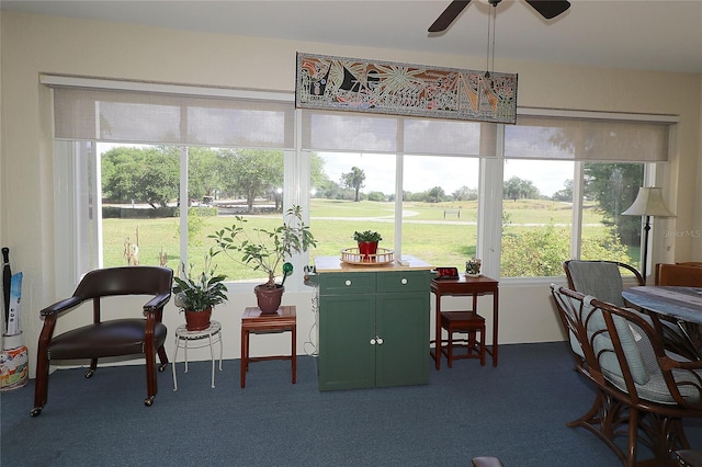 sunroom / solarium with view of golf course