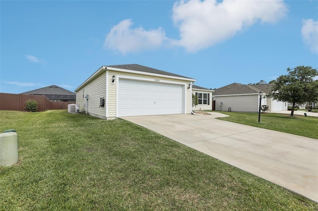 3329 Boyd Cir, Oxford, FL 34484 - view of front of home featuring cooling unit, concrete driveway, and an attached garage