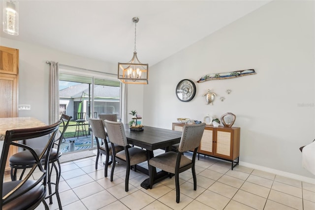 3329 Boyd Cir, Oxford, FL 34484 - dining room featuring a chandelier, lofted ceiling, light tile patterned flooring, and baseboards
