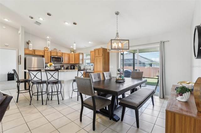 3329 Boyd Cir, Oxford, FL 34484 - dining area featuring a chandelier, light tile patterned floors, and lofted ceiling