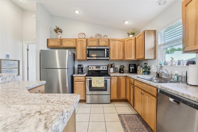 3329 Boyd Cir, Oxford, FL 34484 - kitchen featuring stainless steel appliances, lofted ceiling, light countertops, light tile patterned flooring, and a sink
