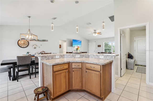 3329 Boyd Cir, Oxford, FL 34484 - kitchen featuring vaulted ceiling, light tile patterned floors, a chandelier, and hanging light fixtures