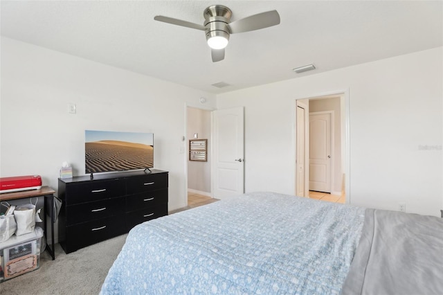 3329 Boyd Cir, Oxford, FL 34484 - bedroom featuring a ceiling fan and light carpet