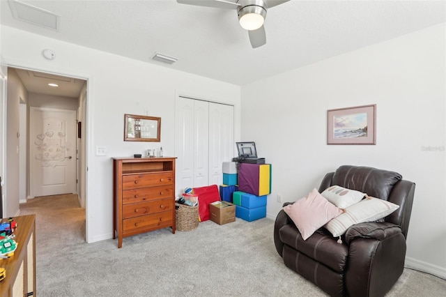 3329 Boyd Cir, Oxford, FL 34484 - sitting room with carpet flooring, ceiling fan, and baseboards