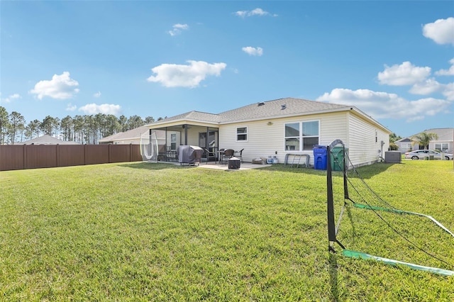 3329 Boyd Cir, Oxford, FL 34484 - rear view of house with a patio, central AC unit, and a sunroom
