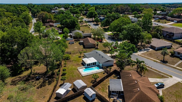 birds eye view of property with a residential view
