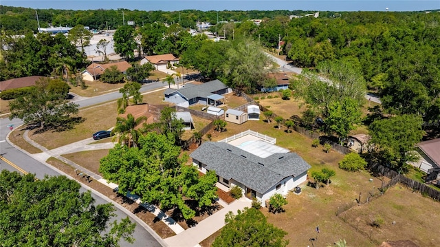 aerial view featuring a wooded view