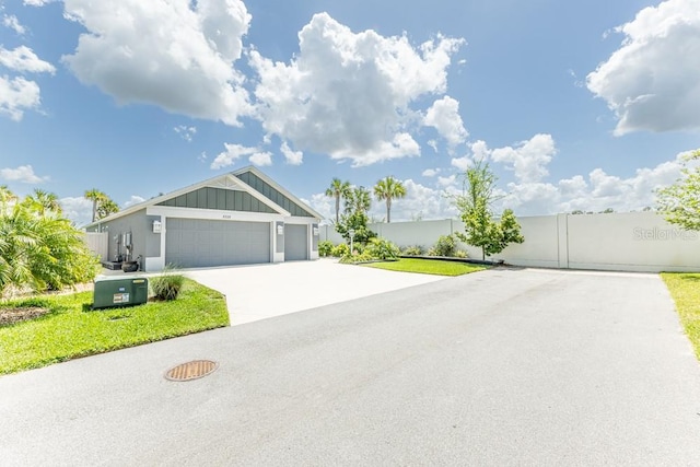 5325 Zisa Ct, The Villages, FL 32163 - single story home with board and batten siding, an attached garage, and driveway