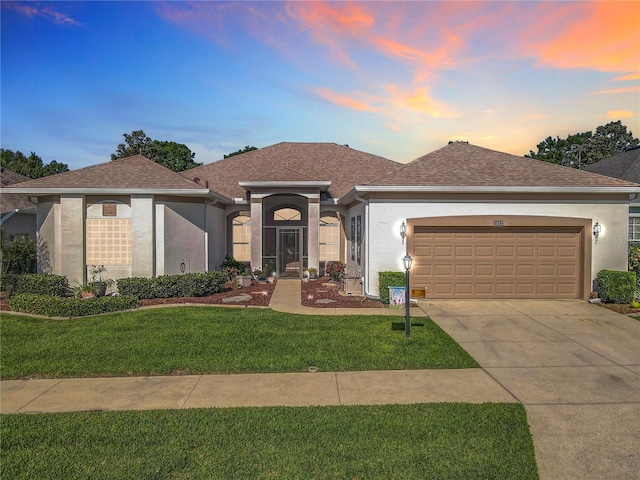 25523 Maurepas Ln, Leesburg, FL 34748 - single story home with driveway, a garage, and stucco siding