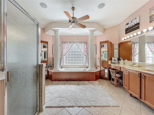 25523 Maurepas Ln, Leesburg, FL 34748 - full bath featuring tile patterned floors, decorative columns, plenty of natural light, and a garden tub