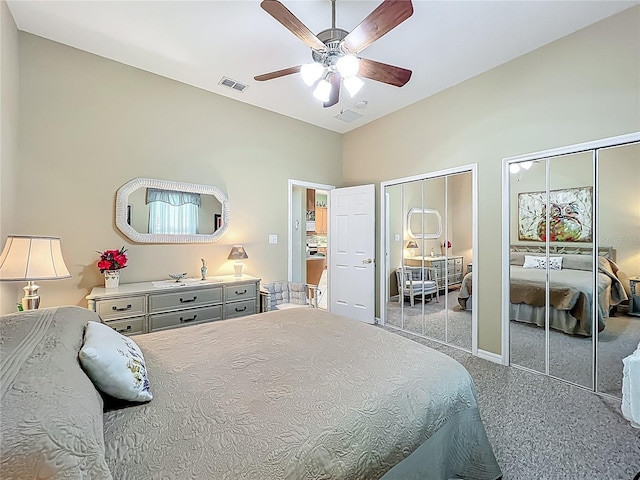 25523 Maurepas Ln, Leesburg, FL 34748 - bedroom with two closets, carpet flooring, ceiling fan, and visible vents