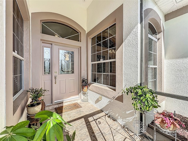 25523 Maurepas Ln, Leesburg, FL 34748 - view of exterior entry featuring stucco siding