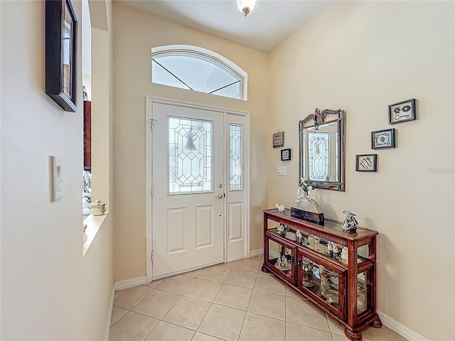 25523 Maurepas Ln, Leesburg, FL 34748 - foyer entrance with baseboards and light tile patterned flooring