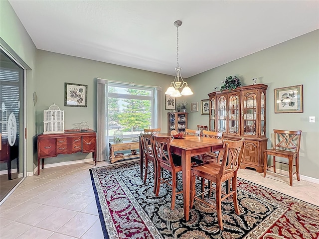 25523 Maurepas Ln, Leesburg, FL 34748 - dining area with baseboards, an inviting chandelier, and light tile patterned flooring
