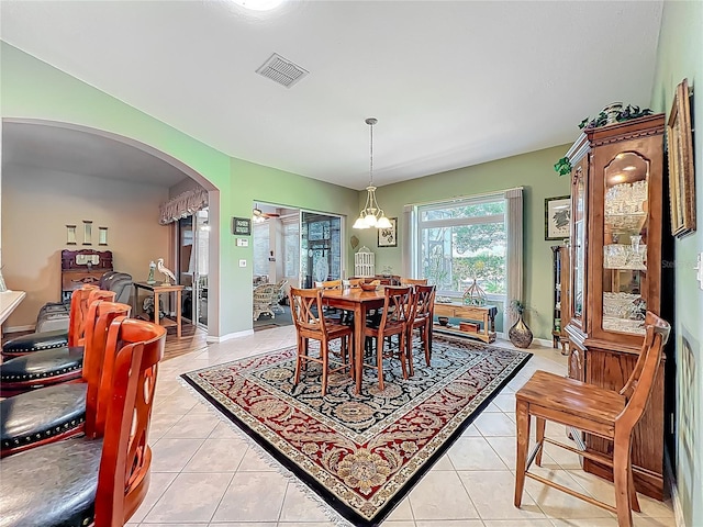 25523 Maurepas Ln, Leesburg, FL 34748 - dining space with arched walkways, light tile patterned floors, and visible vents