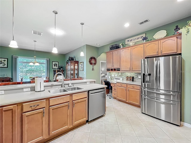 25523 Maurepas Ln, Leesburg, FL 34748 - kitchen featuring visible vents, light countertops, a sink, and appliances with stainless steel finishes