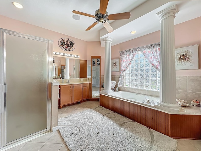 25523 Maurepas Ln, Leesburg, FL 34748 - full bathroom with ceiling fan, ornate columns, tile patterned floors, a stall shower, and a garden tub