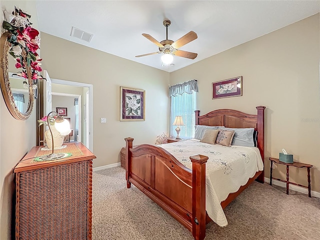 25523 Maurepas Ln, Leesburg, FL 34748 - bedroom with light carpet, visible vents, baseboards, and a ceiling fan
