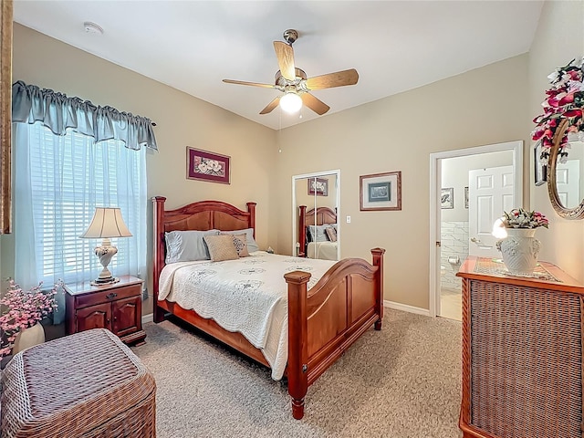 25523 Maurepas Ln, Leesburg, FL 34748 - bedroom with ensuite bathroom, light colored carpet, baseboards, and a ceiling fan