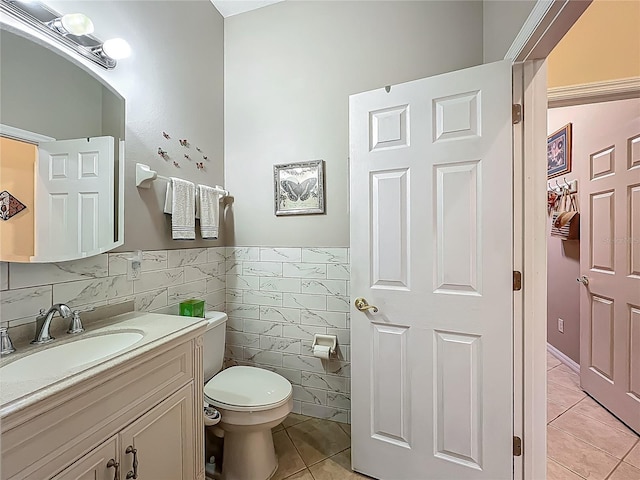 25523 Maurepas Ln, Leesburg, FL 34748 - half bath featuring tile patterned floors, vanity, tile walls, and toilet