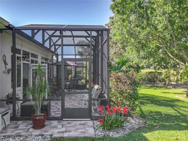 25523 Maurepas Ln, Leesburg, FL 34748 - doorway to property featuring a patio, a lawn, and stucco siding