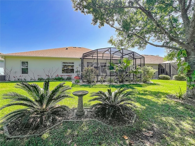 25523 Maurepas Ln, Leesburg, FL 34748 - rear view of property featuring a lanai, a yard, and stucco siding