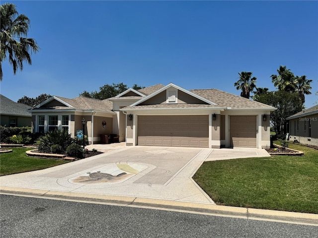 1985 Abordale Ln, The Villages, FL 32162 - view of front of property with a garage, stucco siding, concrete driveway, and a front lawn