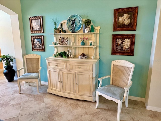 1985 Abordale Ln, The Villages, FL 32162 - sitting room featuring light tile patterned floors, baseboards, and arched walkways