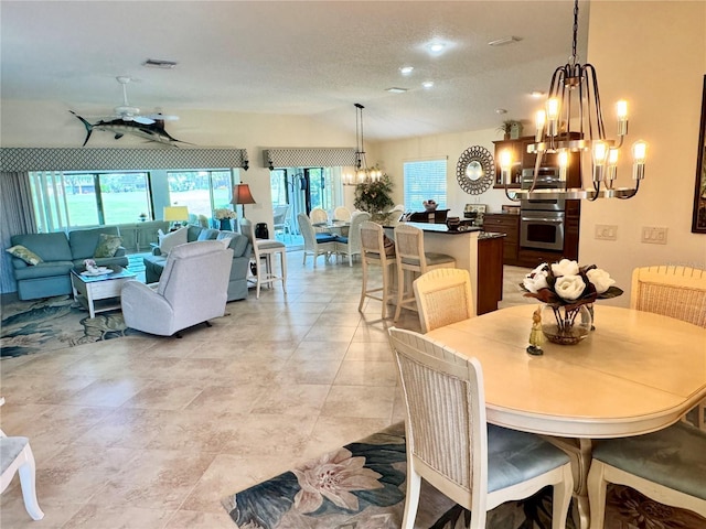 1985 Abordale Ln, The Villages, FL 32162 - dining room featuring visible vents, a textured ceiling, and ceiling fan with notable chandelier