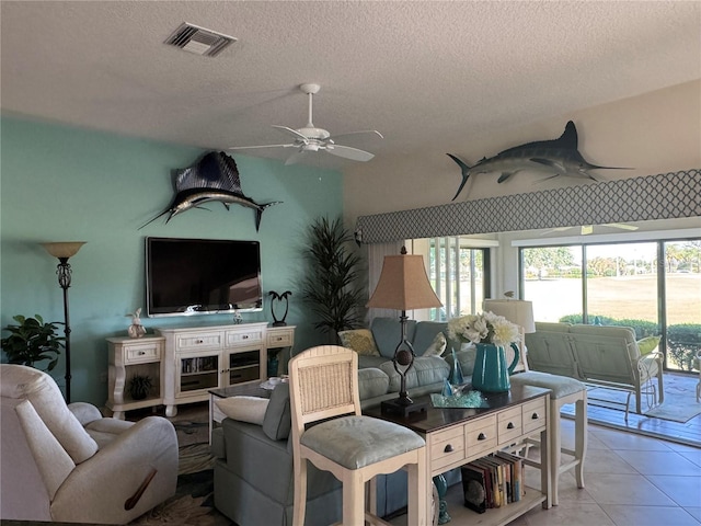1985 Abordale Ln, The Villages, FL 32162 - tiled living area with visible vents, a textured ceiling, and ceiling fan