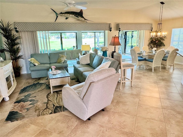 1985 Abordale Ln, The Villages, FL 32162 - tiled living area featuring ceiling fan with notable chandelier