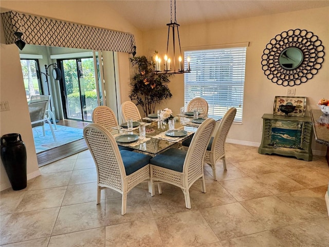 1985 Abordale Ln, The Villages, FL 32162 - dining room with tile patterned floors, baseboards, a chandelier, and lofted ceiling