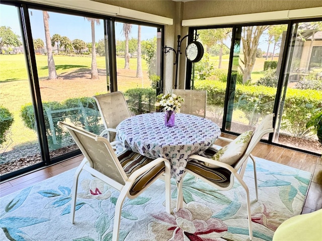 1985 Abordale Ln, The Villages, FL 32162 - sunroom / solarium featuring outdoor dining space and hardwood / wood-style floors