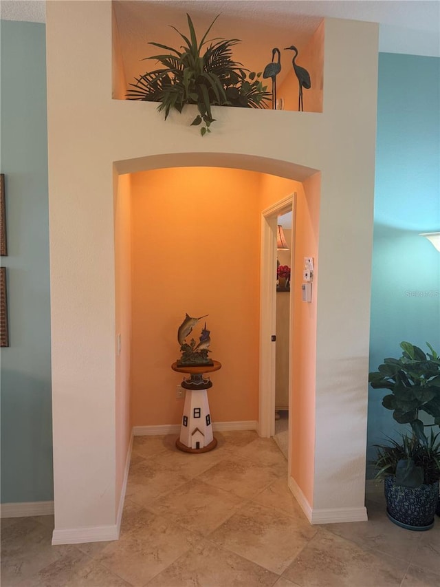 1985 Abordale Ln, The Villages, FL 32162 - corridor featuring baseboards and arched walkways
