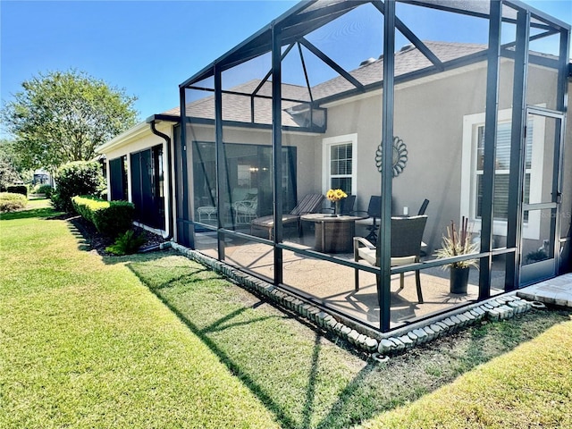 1985 Abordale Ln, The Villages, FL 32162 - rear view of house with a lanai, a yard, a patio, stucco siding, and roof with shingles