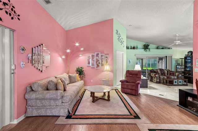 3603 Westerham Dr, Clermont, FL 34711 - living room with a textured ceiling, wood finished floors, ceiling fan, and lofted ceiling