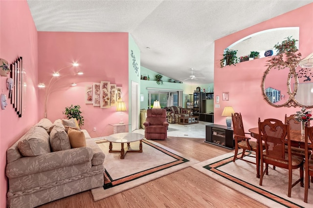 3603 Westerham Dr, Clermont, FL 34711 - living room with a textured ceiling, wood finished floors, a ceiling fan, and lofted ceiling